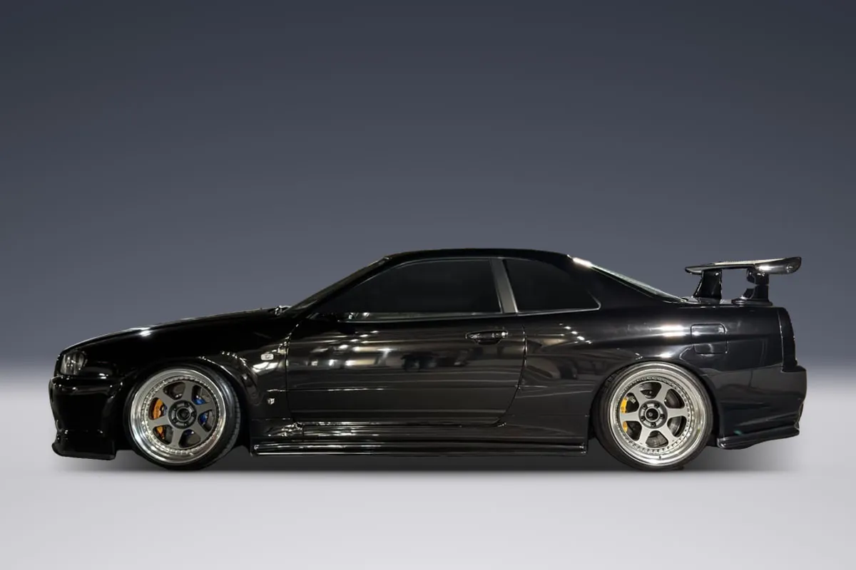 Black Nissan Skyline GT-R R34, side view